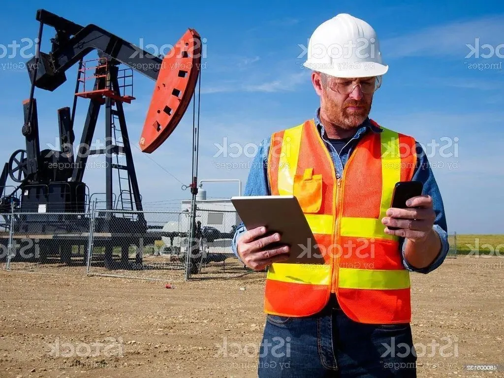man in oil field using e-ticketing software